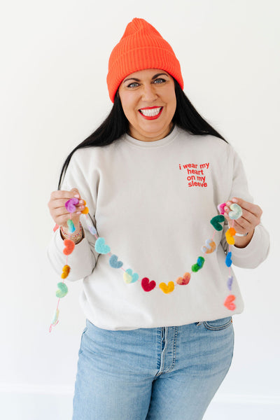 heart on sleeve pullover sweatshirt
