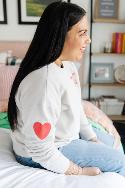 heart on sleeve pullover sweatshirt
